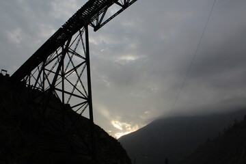 train bridge over two mountains