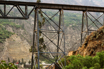 train bridge over two mountains