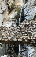 cold water flowing through a waterfall of stones