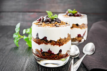 Dessert Black Forest in two glasses on wooden table