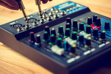 Selective focus to sound electronics mixer and gold mic jack.