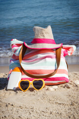 Accessories for relax or sunbathing on sand at beach. Travel and vacation time