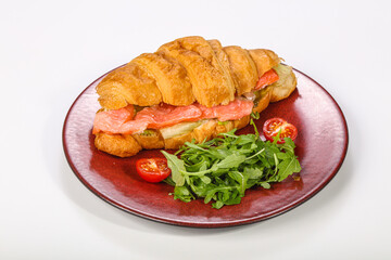 Croissant with salmon for breakfast