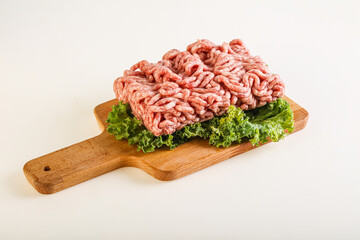 Raw pork minced meat over board