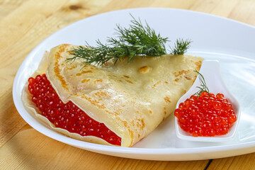 Russian pancake with red caviar