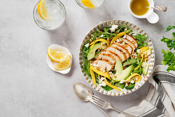 Easy Grilled Chicken breast salad with mango and avocado slices, sprinkled with walnuts and feta...