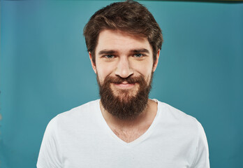 Obraz premium Portrait of a man with a thick beard white t-shirt brunette model close-up