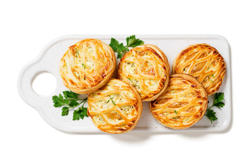 Spinach and ricotta stuffed puff pastry mini pies. isolated on white background	