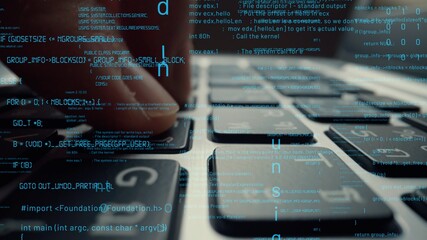 Creative visual of computer programming coding and software development shown by man working on computer keyboard with overlay of computer graphic displaying abstract program codes and computer script