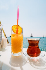 Fresh Tea and orange juice in a beautiful location with sea views