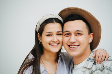 Portrait of a young couple standing close to each other, pressing cheeks