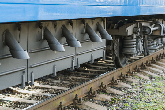Truskavets, Ukraine - April 2021: Wheels of passenger train, which awaiting departure on the platform of the railway station. Ukrzaliznytsia. Ukrainian railways.