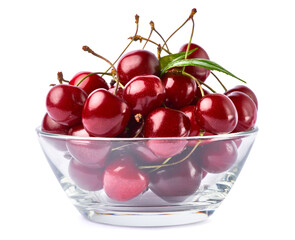 glass bowl of sweet cherry fruits isolated on white background