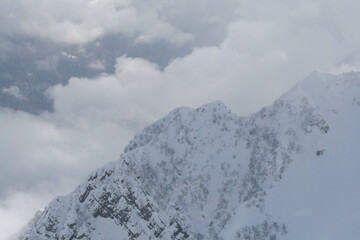 Fototapeta na wymiar Snow-capped ridges of the Caucasus Mountains, Sochi, Russia.