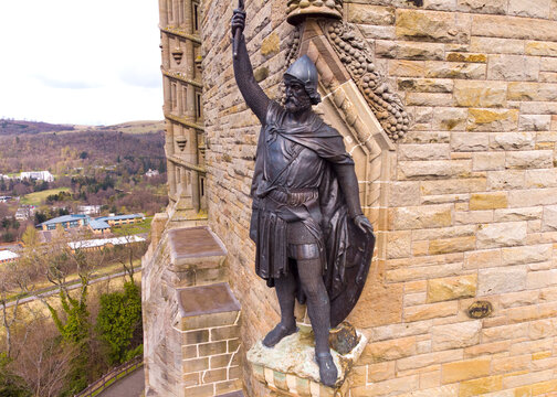 William Wallace statue stands proudly.The National Wallace Monument is a tower standing on a hilltop in Stirling in Scotland.It commemorates Sir William Wallace, a 13th and 14th-century Scottish hero.