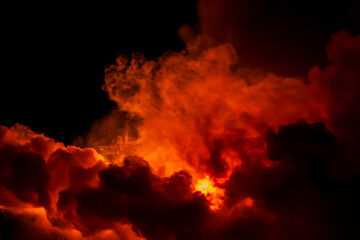 A large red cloud of smoke from the fire. Close-up
