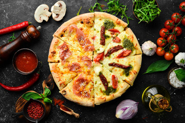 Delicious Italian pizza with mozzarella cheese and tomatoes. Top view. Food delivery.