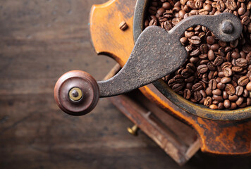 close-up of old coffee grinder and roasted coffee beans