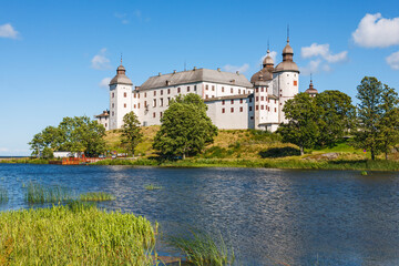 Lacko castle on a hill by a lake Vanern