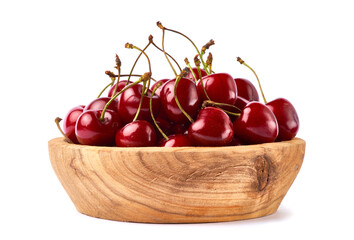 wooden bowl of sweet cherry fruits isolated on white background