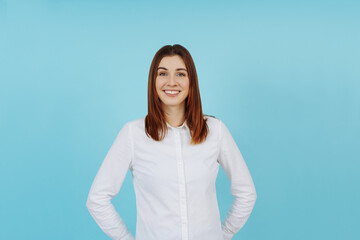 Happy smiling studio portrait of a trendy young woman
