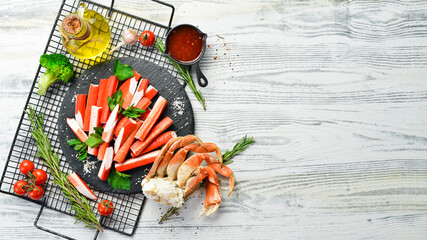 Crab sticks with spices on a plate. Cooking salad. Rustic style. Seafood delicacies. © Yaruniv-Studio