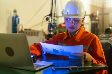 asian female engineer specialist with Measuring machine with a manipulator arm.Three-dimensional coordinate measurement. Check sizes. 3D check of the sizes of parts. CMM after machining process