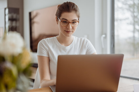 Hardworking Young Woman Concentrating On Her Work