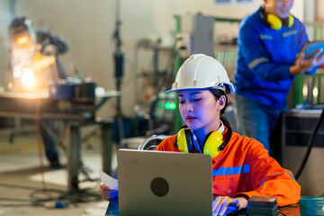 engineer specialist asian female and  technician maintenance inspect relay robot arm system with...