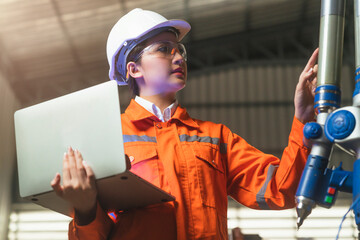 asian female engineer specialist with Measuring machine with a manipulator arm.Three-dimensional...