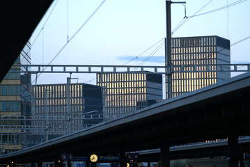 Skyscrapers at Zurich north at dusk with train station Oerlikon in the foreground. Photo taken April 9th, 2021, Zurich, Switzerland.