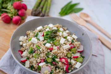 healthy spring salad with asparagus, barley and cheese