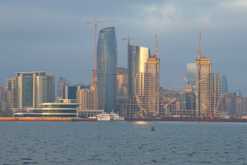 Obraz premium Construction of modern high-rise buildings on the shore of Baku Bay