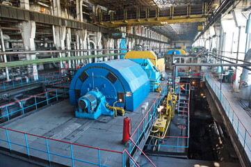Petropavlovsk, Kazakhstan - 05.26.2015 : The territory of the power plant with large industrial compartments for turbine generators and pipes.