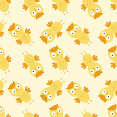 Obraz premium Seamless background with yellow owls for printing on baby fabric. Wallpaper with an owl for sewing children's clothing and packaging paper.