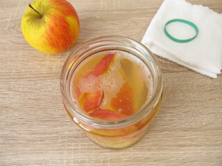 Preperation of homemade apple cider vinegar from apple scraps in a jar