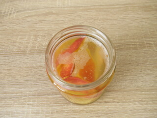Preperation of homemade apple cider vinegar from apple scraps in a jar