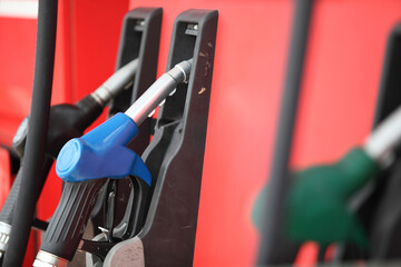  Petrol pump filling nozzles isolated , Gas station in a service  with fuel pump nozzle at modern...
