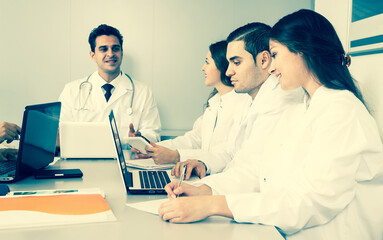 doctors in negotiations in conference room