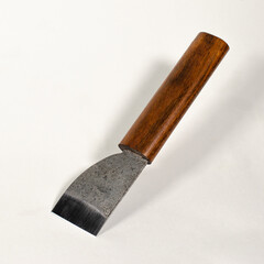 knife for making leather on a white background