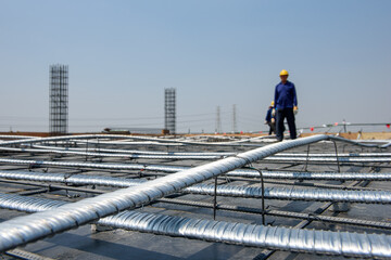 Naklejka premium Concrete reinforcement with tensioned cables in the structure of beam. prestress concrete. blue tone