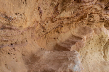 Geological rock formations that look like a path through the desert mountains.