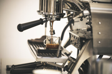 Close-Up of professional coffee machine making a cup of coffee. It's coffeemakers or coffee machines are cooking appliances used to coffee