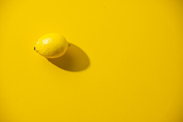 Lemon on yellow background.
Flesh lemon on yellow text space.
