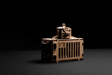 Toy wooden port container with motorcycle inside