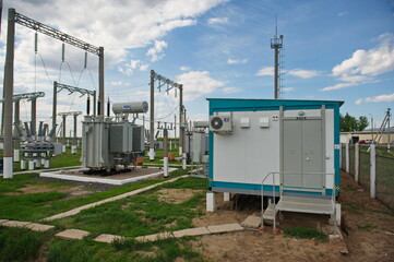 Fototapeta na wymiar Nur-Sultan, Kazakhstan - 05.28.2015 : High-voltage power lines with insulators, stabilizers and transformers.