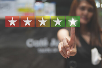 Customer review good rating concept hand pressing five star on visual screen and positive customer...