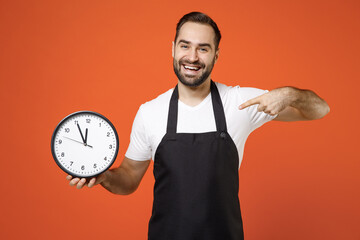 Young man barista bartender barman employee wear black apron white t-shirt work in coffee shop sow...