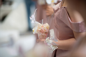 wedding flower on hand with blur background, bouquet flower