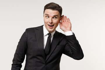 Young curious nosy employee business corporate lawyer man 20s in classic formal black grey suit...